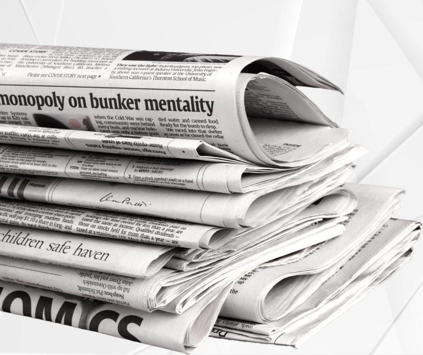 A photo of several folded newspapers sitting in a pile